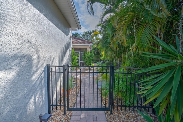 view of gate with fence