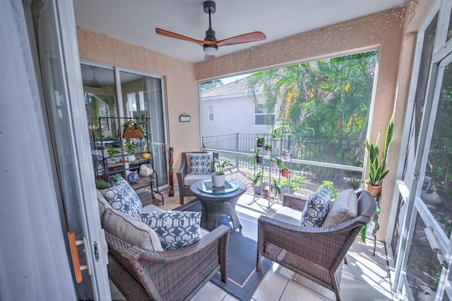 sunroom / solarium with a ceiling fan