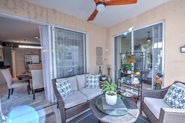 interior space with ceiling fan and an outdoor living space