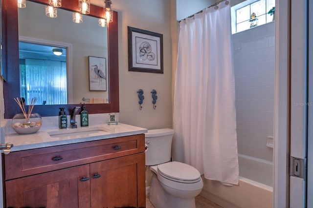 full bathroom featuring shower / tub combo with curtain, vanity, and toilet