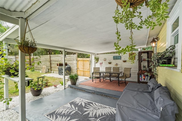 sunroom featuring lofted ceiling