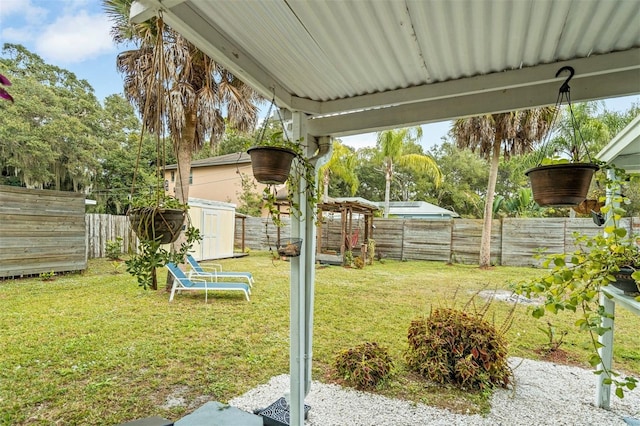 view of yard with a storage unit