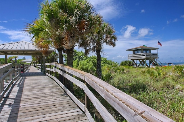 dock area with a water view and a gazebo