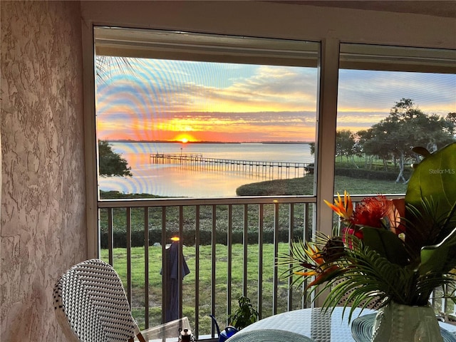 balcony at dusk with a water view