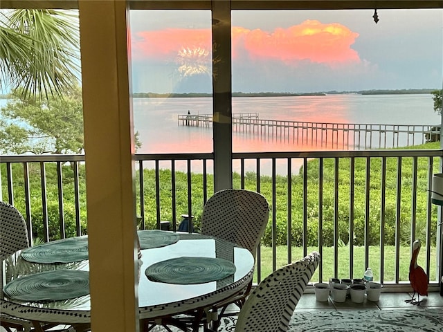 balcony at dusk with a water view