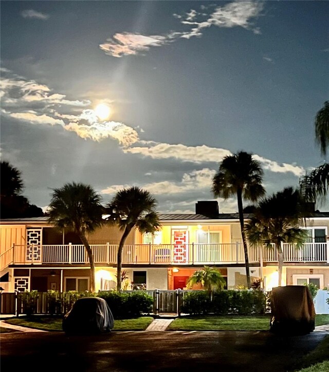 view of outdoor building at dusk