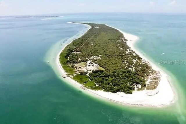 drone / aerial view with a view of the beach and a water view