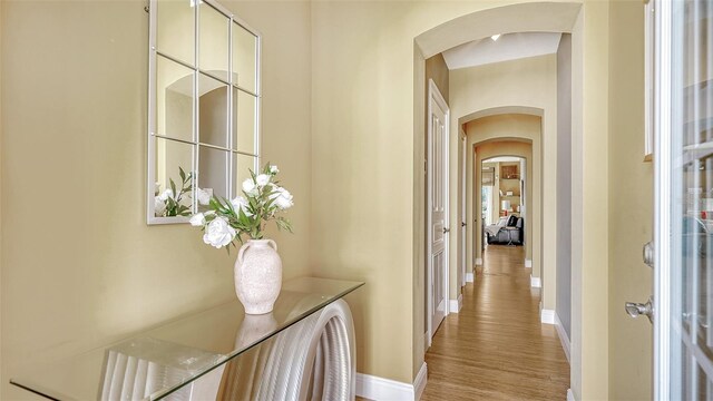 corridor with light hardwood / wood-style flooring