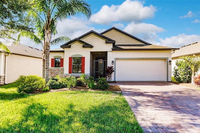 view of front of property featuring a garage and a front yard