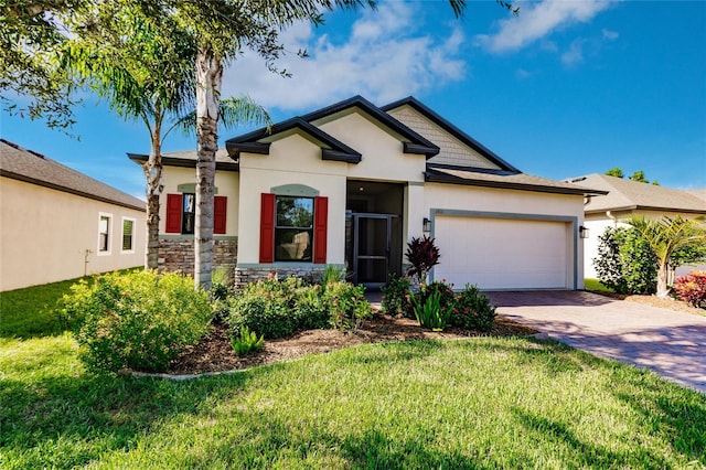 view of front of property with a garage and a front lawn