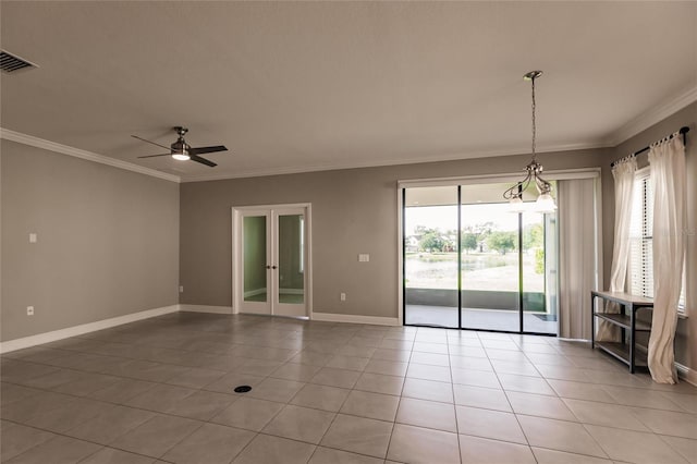 unfurnished room with crown molding, ceiling fan, and light tile patterned flooring