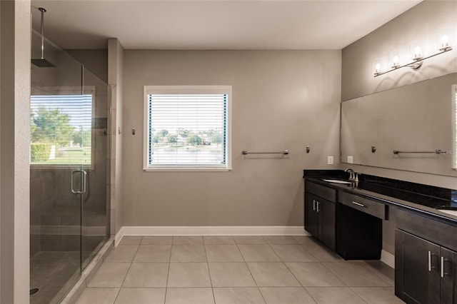 bathroom featuring tile patterned floors, vanity, and an enclosed shower