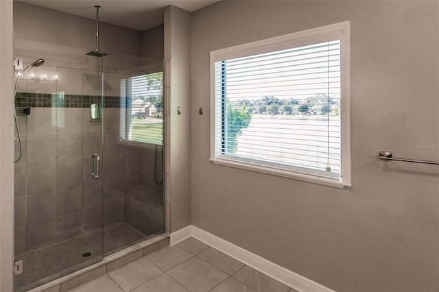 bathroom with tile patterned floors and walk in shower