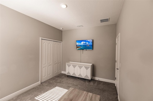 bedroom with carpet floors and a closet