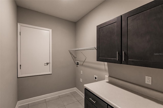 laundry room featuring washer hookup, light tile patterned floors, cabinets, and hookup for an electric dryer