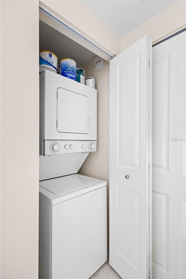 laundry room featuring stacked washer / dryer