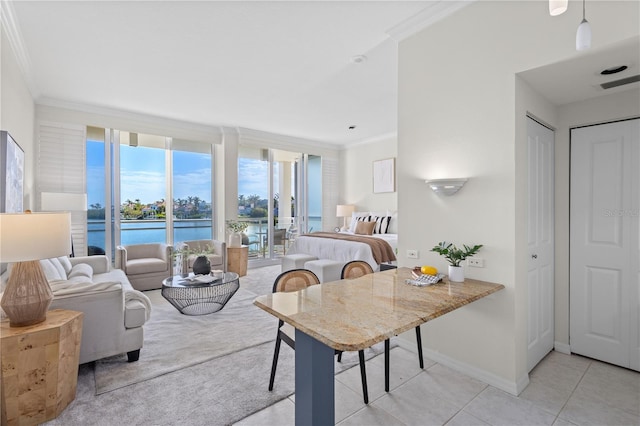 tiled dining space with a water view, expansive windows, and ornamental molding