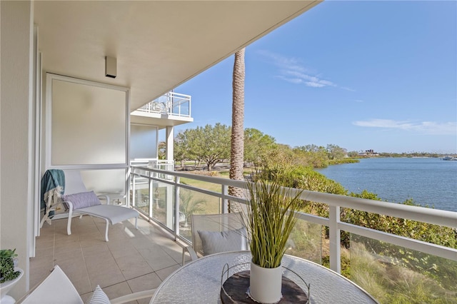 balcony featuring a water view