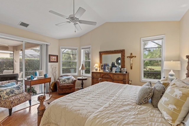 bedroom with ceiling fan, lofted ceiling, and hardwood / wood-style floors