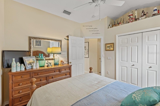 bedroom featuring ceiling fan, a closet, and vaulted ceiling