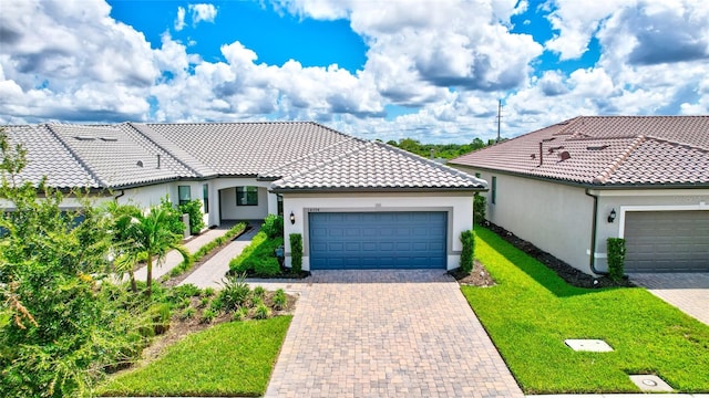 view of front facade with a garage and a front lawn