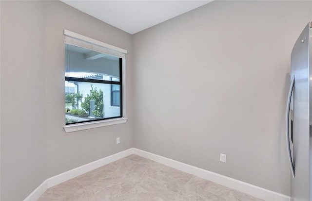 empty room featuring light tile patterned floors