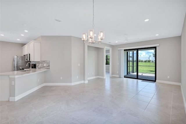 interior space featuring a chandelier and sink