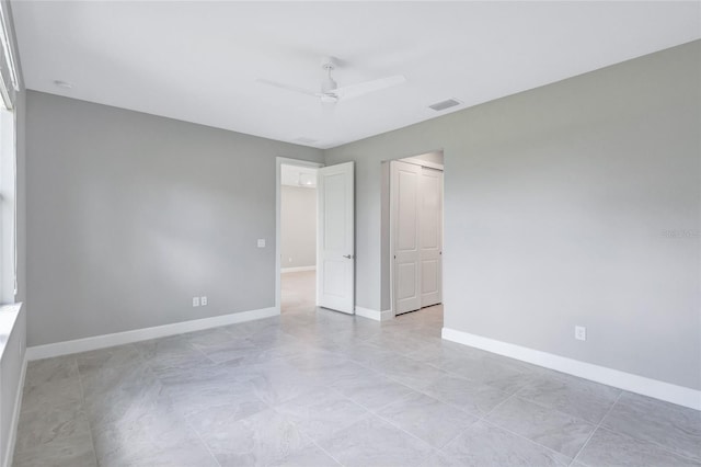 spare room with ceiling fan