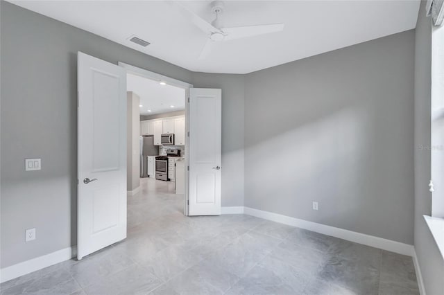 spare room featuring ceiling fan