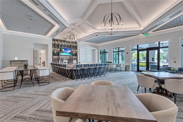 dining area featuring ornamental molding, vaulted ceiling with beams, a notable chandelier, and french doors