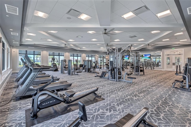 workout area featuring ceiling fan and carpet floors