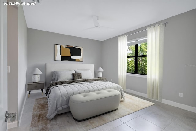 tiled bedroom with ceiling fan