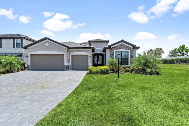 view of front facade featuring a garage and a front lawn