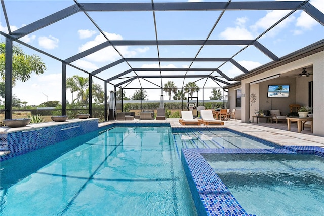 view of pool with an outdoor hangout area, glass enclosure, a patio, and ceiling fan