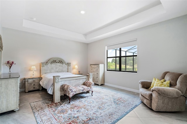 tiled bedroom with a raised ceiling