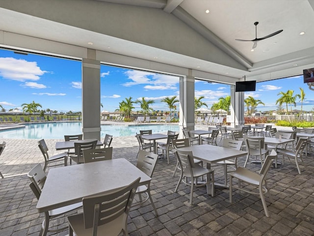 view of patio / terrace featuring a community pool and ceiling fan