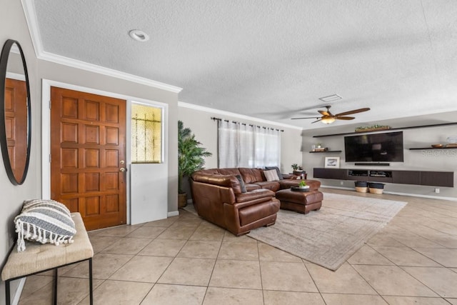 tiled living room featuring ceiling fan, crown molding, and a textured ceiling