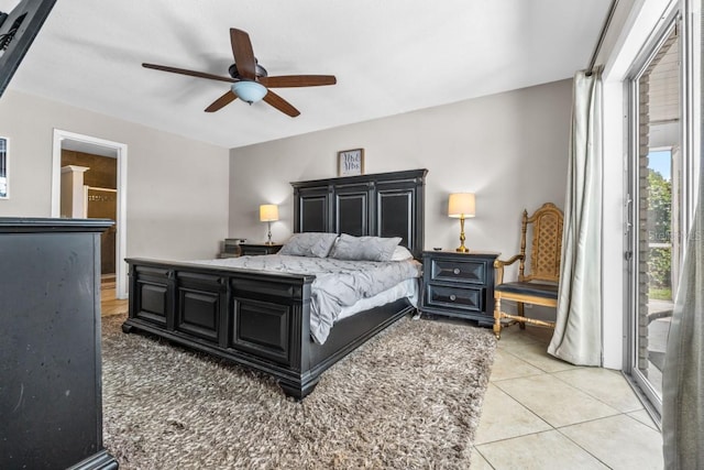 bedroom with ceiling fan, light tile patterned flooring, and access to exterior