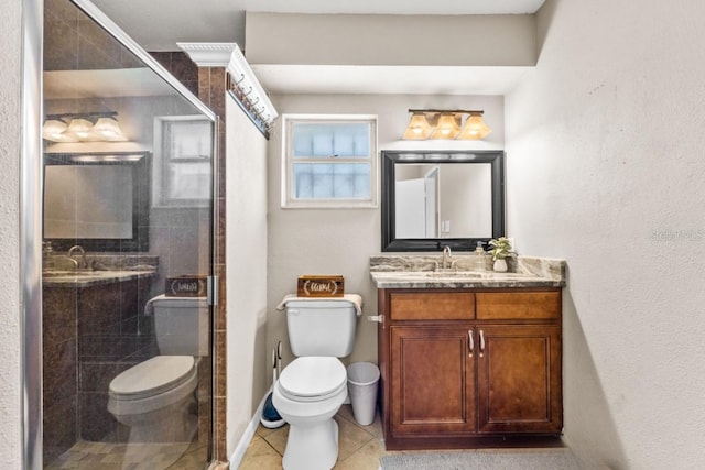 bathroom with a shower with shower door, toilet, and vanity