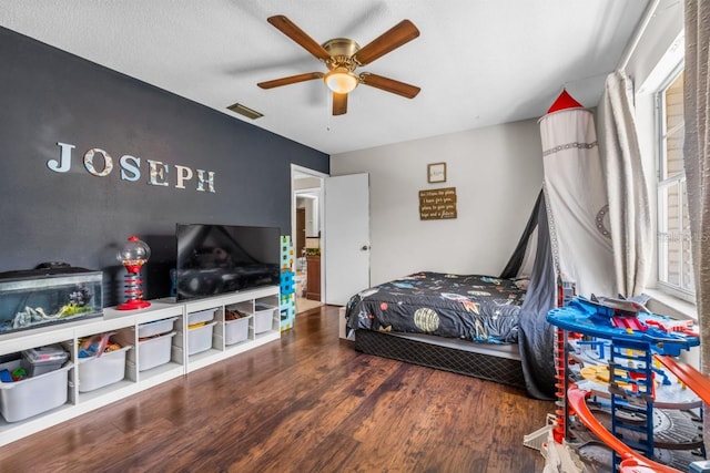 bedroom featuring ceiling fan and dark hardwood / wood-style floors