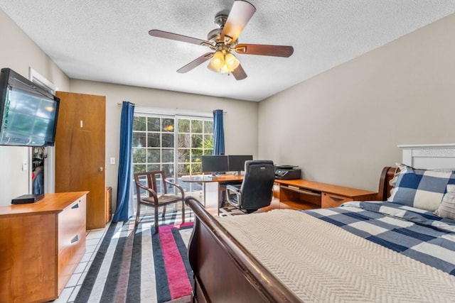 bedroom featuring a textured ceiling and ceiling fan