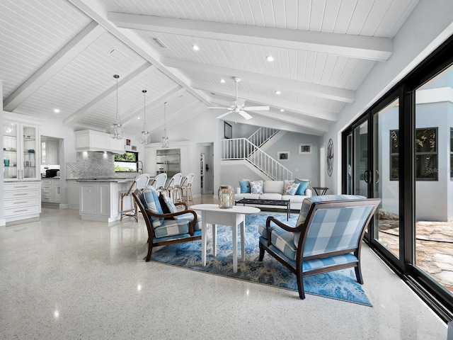 1400 Quail Dr, Sarasota, FL 34231 - living area featuring light speckled floor, beam ceiling, stairway, ceiling fan, and high vaulted ceiling