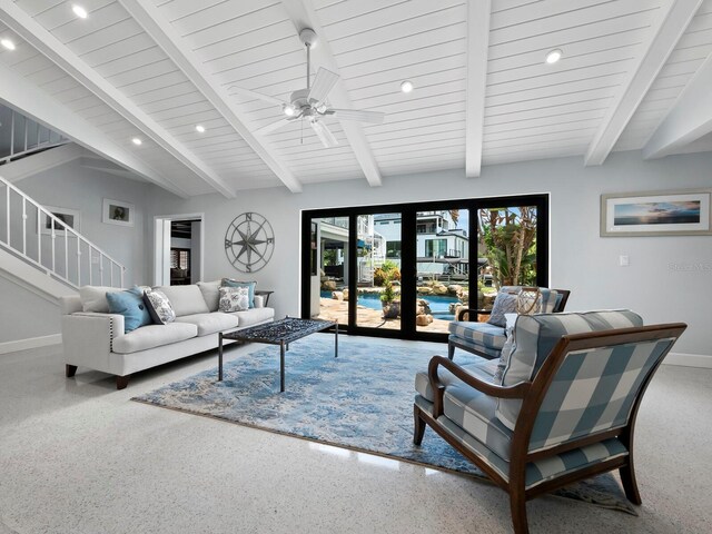 living room with french doors, carpet floors, ceiling fan, and vaulted ceiling with beams