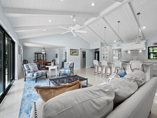 living room with high vaulted ceiling, beam ceiling, and ceiling fan