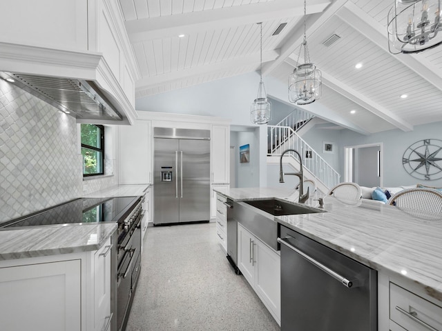 1400 Quail Dr, Sarasota, FL 34231 - kitchen featuring visible vents, light stone counters, stainless steel appliances, white cabinetry, and light speckled floor