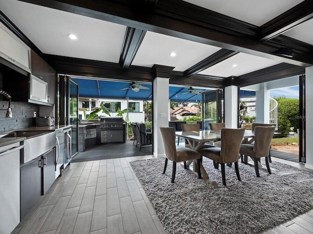 1400 Quail Dr, Sarasota, FL 34231 - dining area with coffered ceiling, a sunroom, wood tiled floor, beamed ceiling, and crown molding