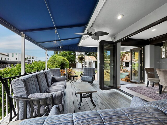 exterior space with outdoor lounge area and ceiling fan