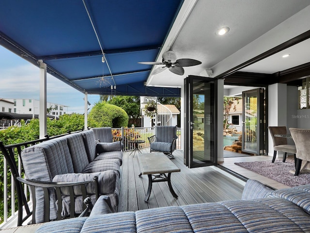 1400 Quail Dr, Sarasota, FL 34231 - wooden deck with ceiling fan and an outdoor living space