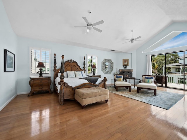 1400 Quail Dr, Sarasota, FL 34231 - bedroom featuring access to outside, multiple windows, and wood finished floors
