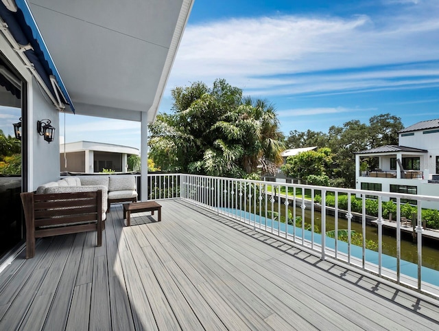 1400 Quail Dr, Sarasota, FL 34231 - deck featuring a water view and an outdoor living space